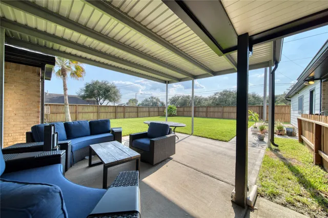 a dining room with furniture and chandelier