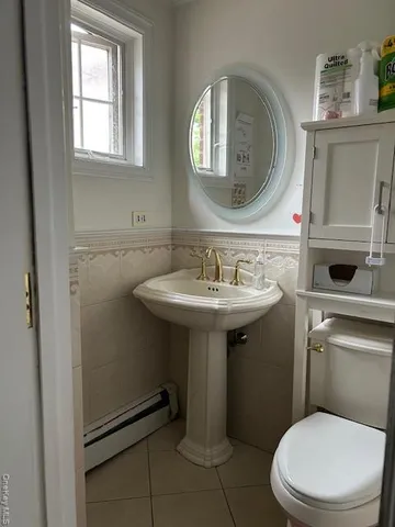 a bathroom with a granite countertop toilet a sink and bathtub