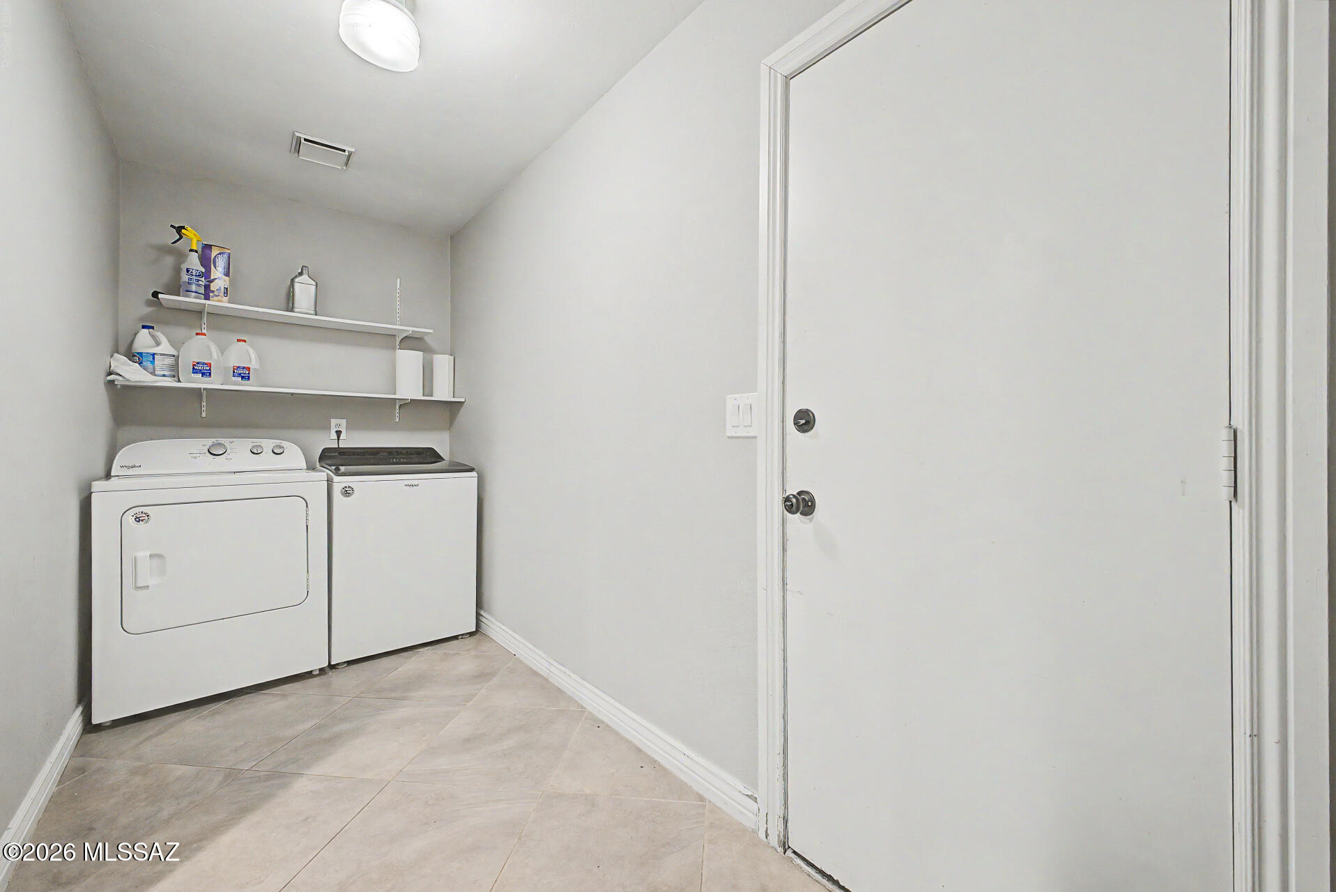 7550 East Rio Verde Drive Tucson, AZ 85715 - Photo 21 of 25 Enjoy the convenience of a dedicated laundry room with plenty of space for storage and organized.