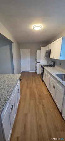 a spacious bathroom with a granite countertop sink and a granite counter top