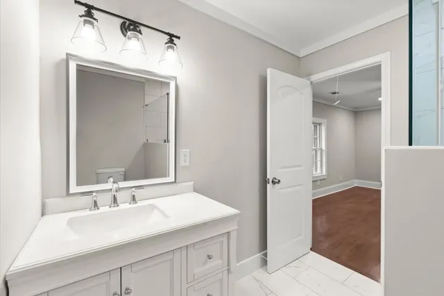 a bathroom with a sink and a mirror