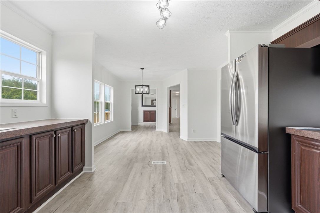 112 Sir Francis Drake Way Liberty, SC 29657 - Photo 32 of 42 Bright and airy living spaces seamlessly flow, featuring modern flooring and ample natural light.