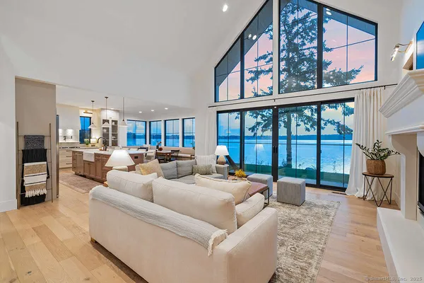 a kitchen with stainless steel appliances kitchen island granite countertop a sink and a stove top oven