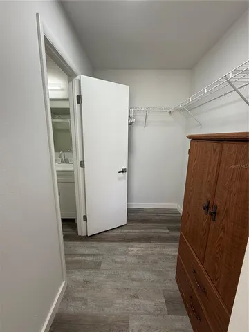 a bathroom with a double vanity sink toilet mirror and shower