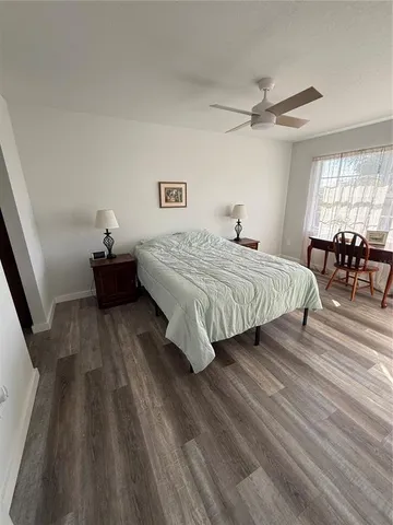 a bathroom with a double vanity sink toilet mirror and shower