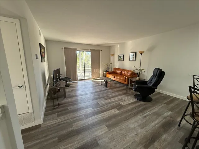 a kitchen with a sink cabinets stainless steel appliances and a window