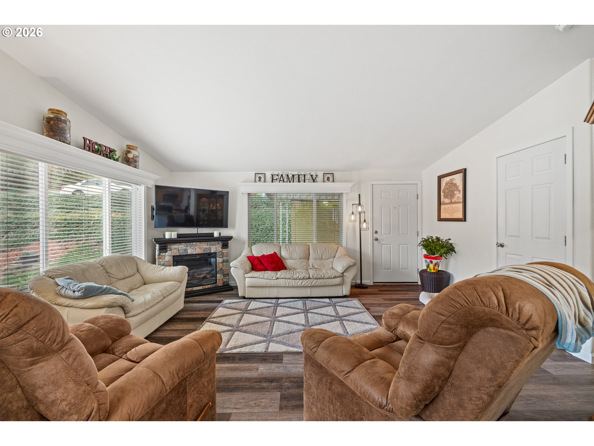 1050 North Cedar Point Road, Unit C09 Coquille, OR 97423 - Photo 11 of 38 a living room with furniture a flat screen tv and a large window