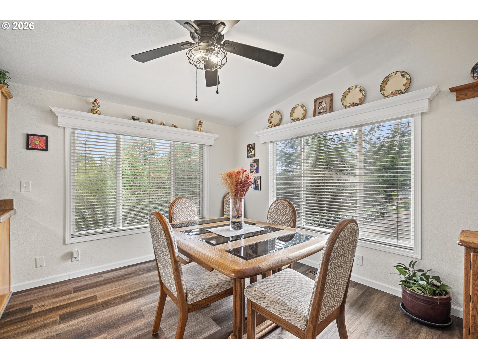 1050 North Cedar Point Road, Unit C09 Coquille, OR 97423 - Photo 12 of 38 a dining room with furniture garden view and a chandelier