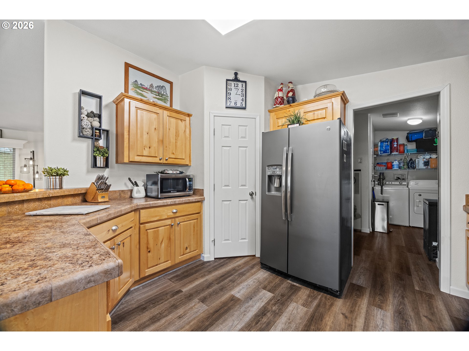 1050 North Cedar Point Road, Unit C09 Coquille, OR 97423 - Photo 15 of 38 a kitchen with stainless steel appliances granite countertop a refrigerator and a sink