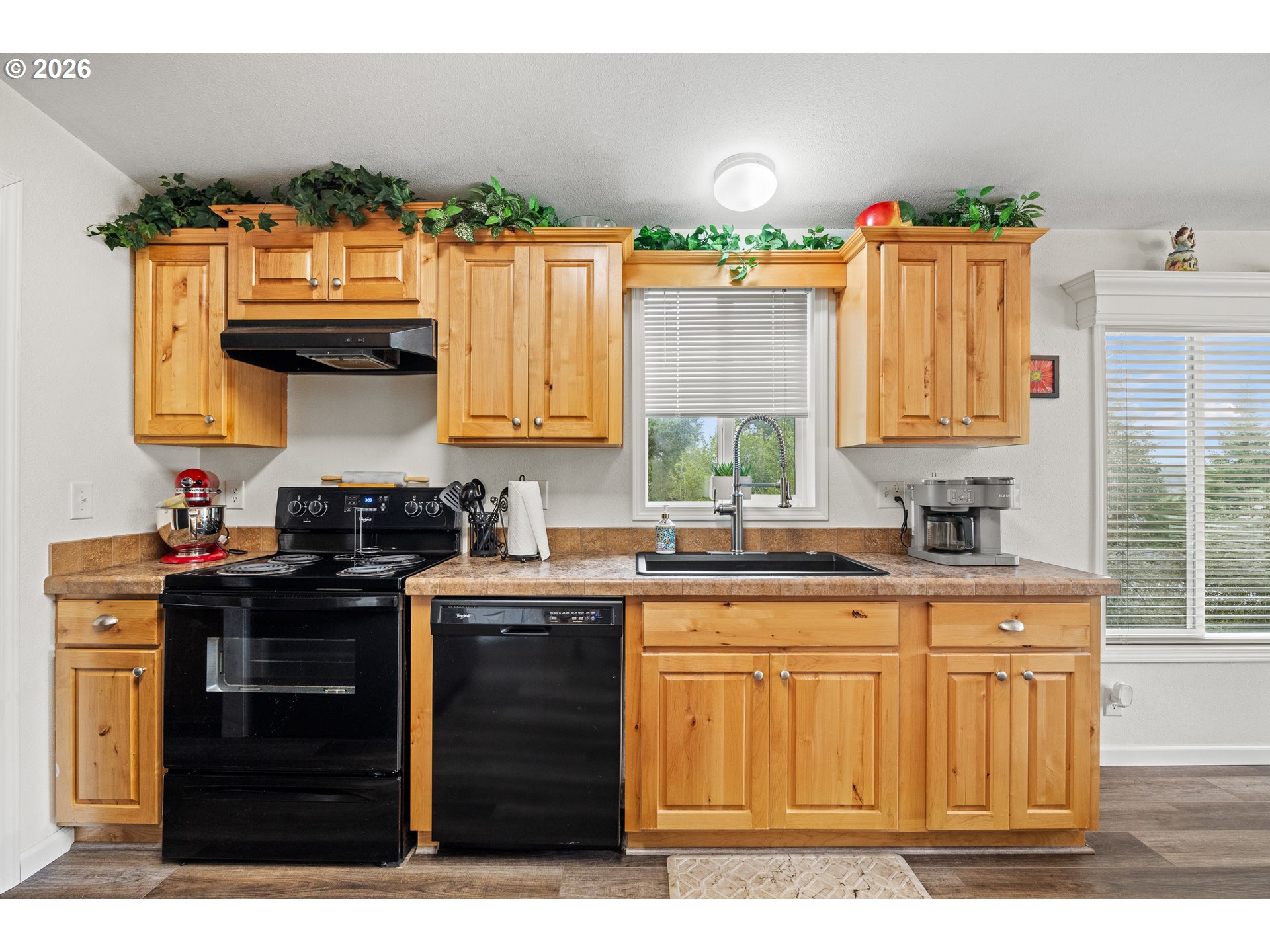 1050 North Cedar Point Road, Unit C09 Coquille, OR 97423 - Photo 17 of 38 a kitchen with a sink and cabinets