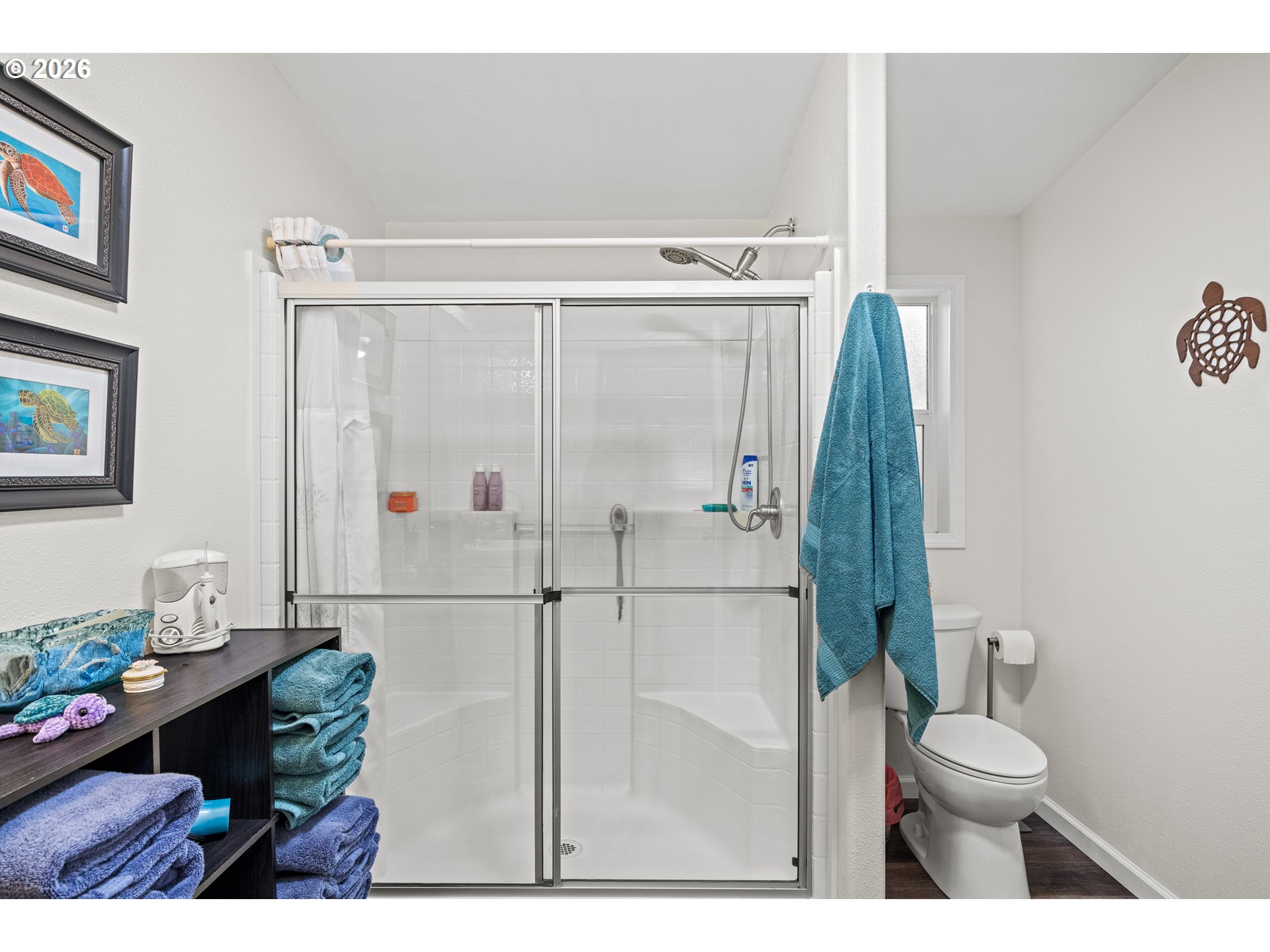 1050 North Cedar Point Road, Unit C09 Coquille, OR 97423 - Photo 21 of 38 a bathroom with a toilet and a shower