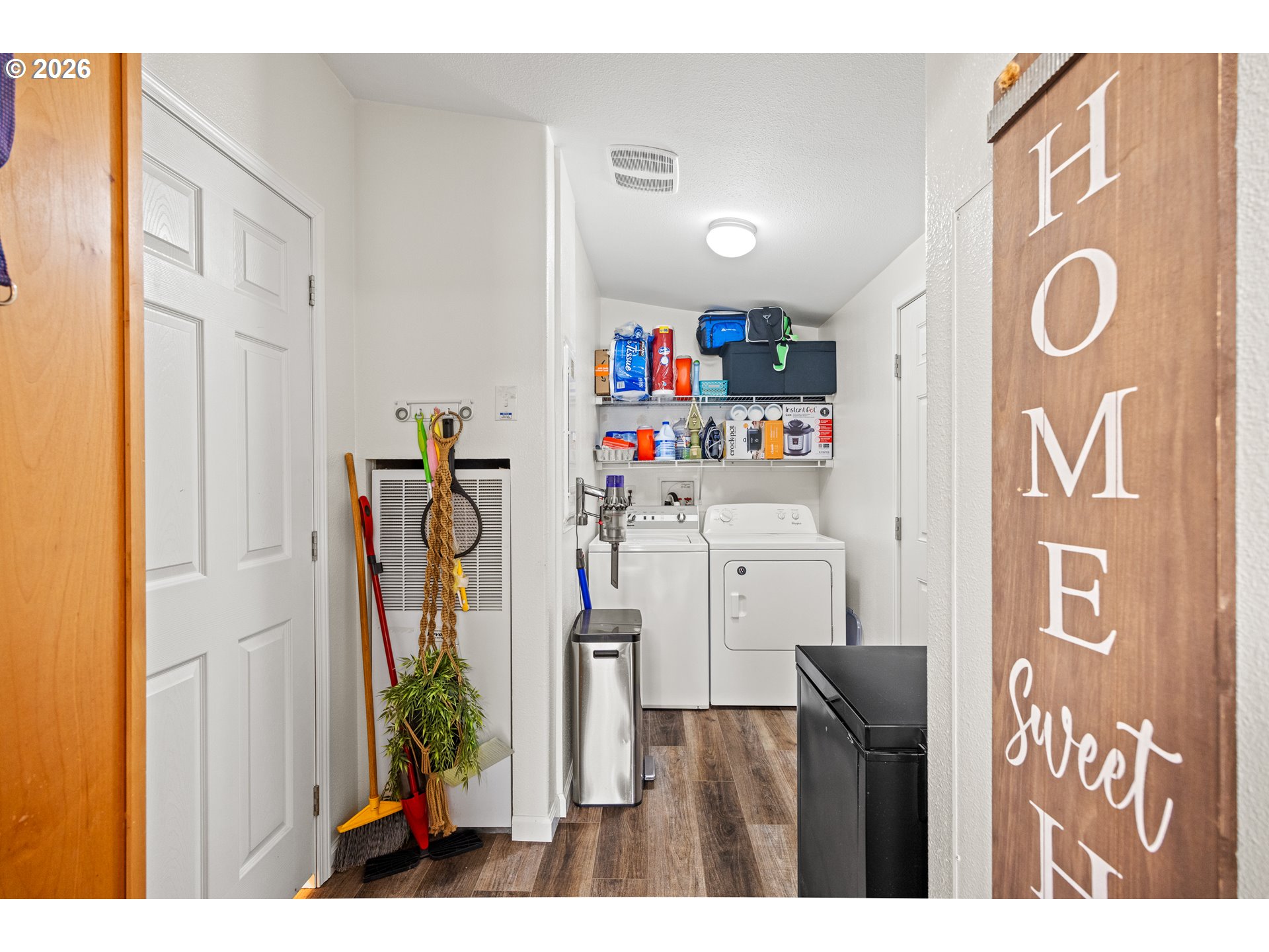 1050 North Cedar Point Road, Unit C09 Coquille, OR 97423 - Photo 27 of 38 a utility room with multiple dryer and washer