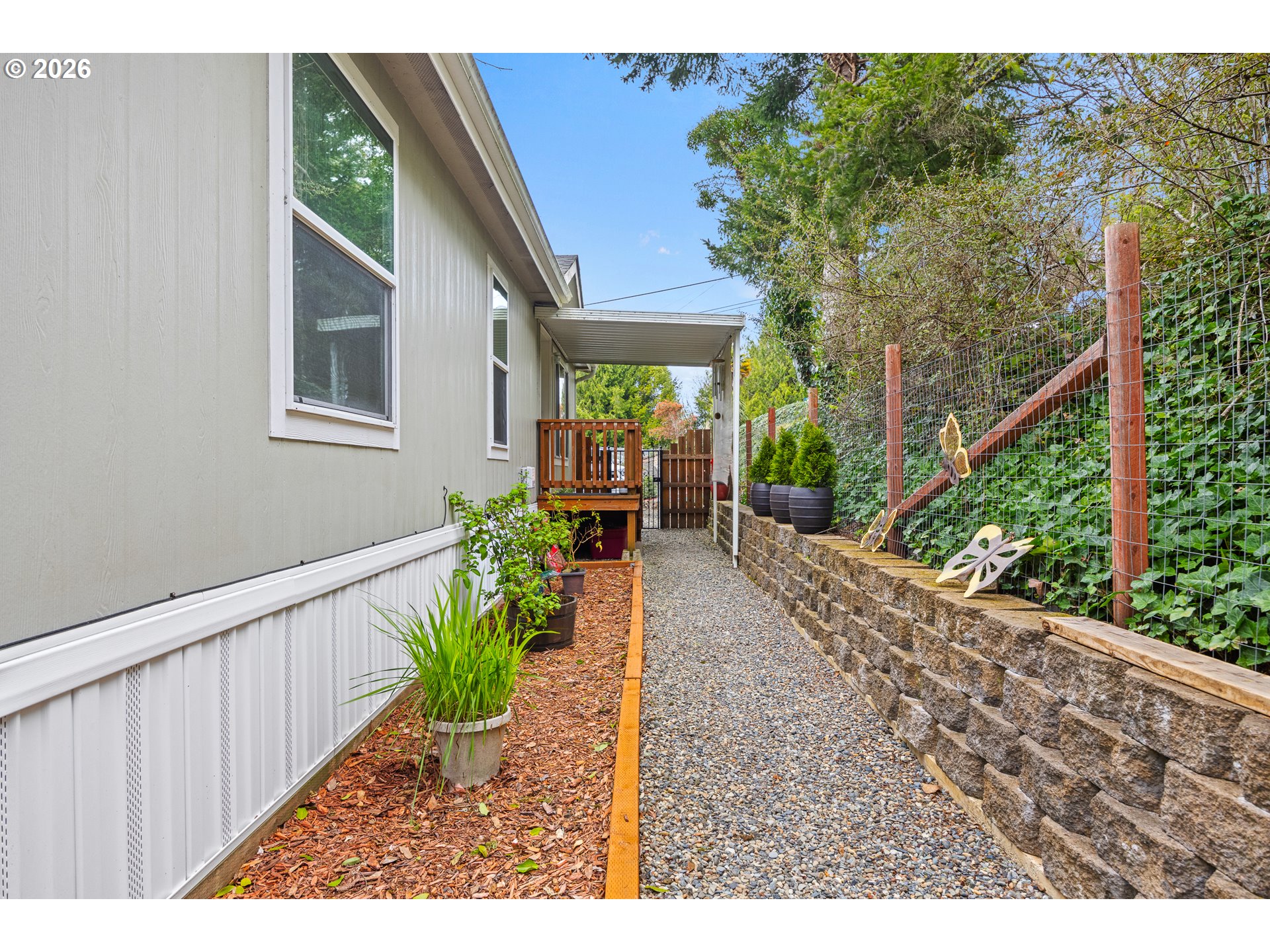 1050 North Cedar Point Road, Unit C09 Coquille, OR 97423 - Photo 31 of 38 a view of a house with backyard and sitting area