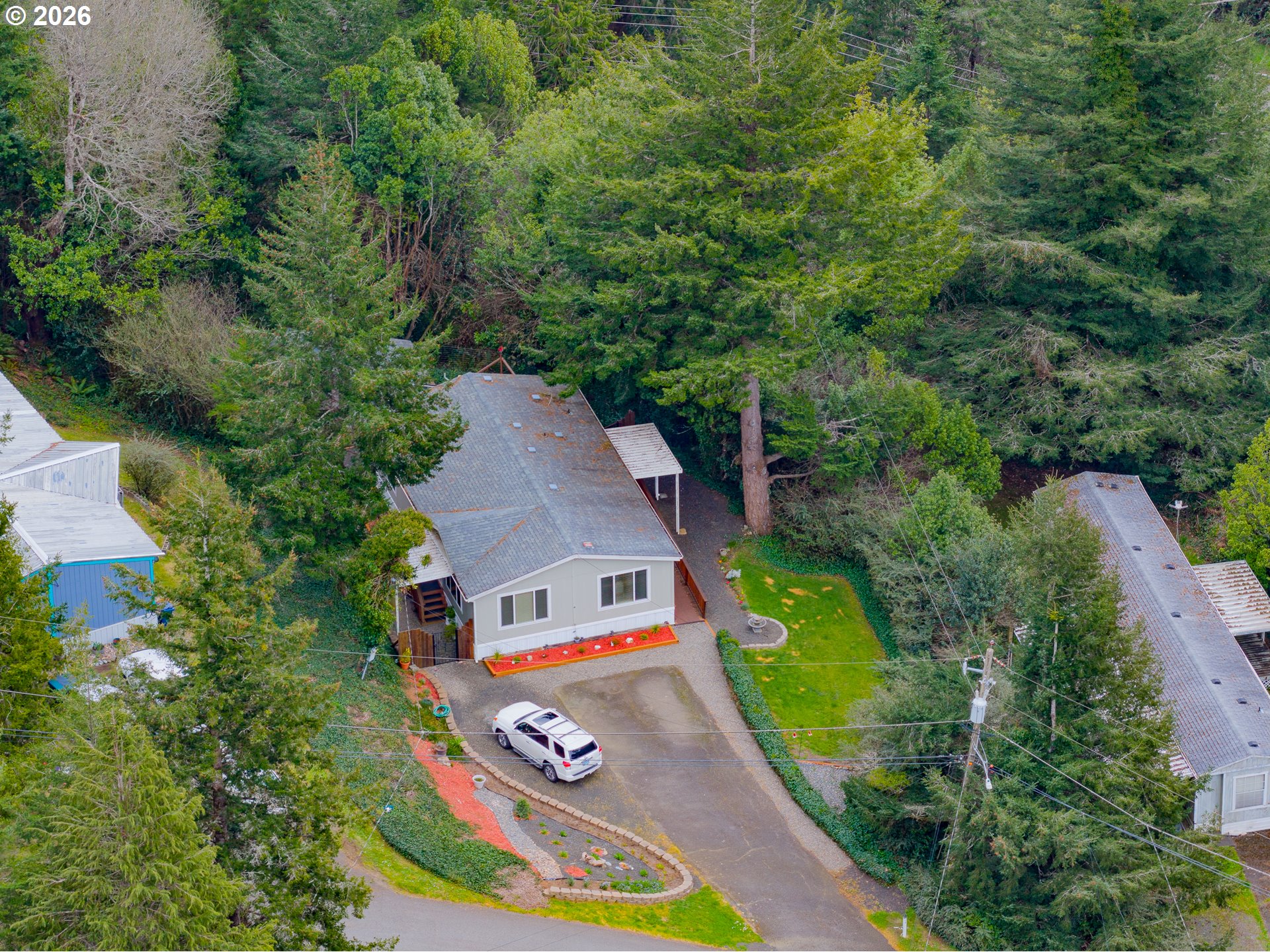 1050 North Cedar Point Road, Unit C09 Coquille, OR 97423 - Photo 34 of 38 an aerial view of a house