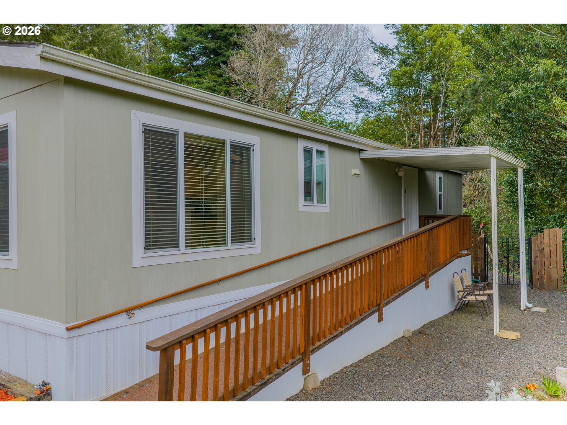1050 North Cedar Point Road, Unit C09 Coquille, OR 97423 - Photo 5 of 38 a view of a house with a yard