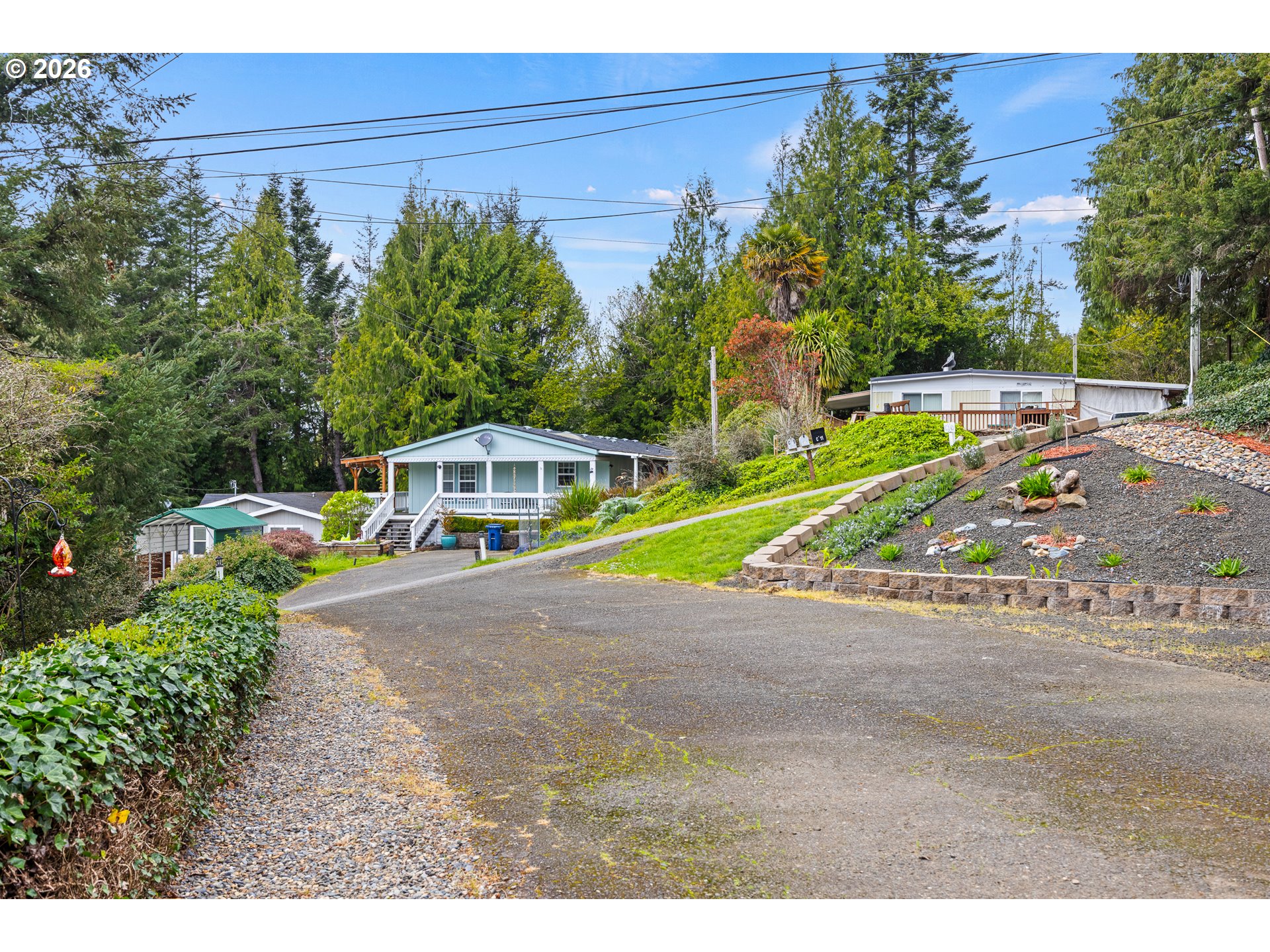 1050 North Cedar Point Road, Unit C09 Coquille, OR 97423 - Photo 7 of 38 a view of a park with large trees