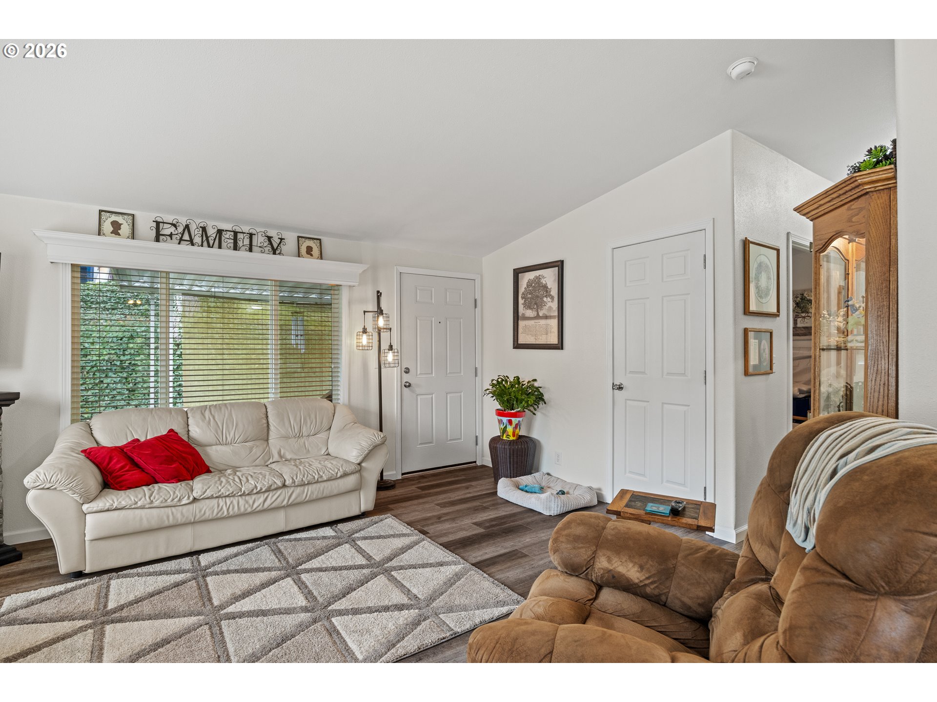1050 North Cedar Point Road, Unit C09 Coquille, OR 97423 - Photo 9 of 38 a living room with furniture and a large window