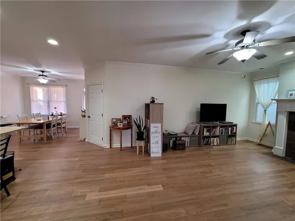 a view of a livingroom with furniture and a flat screen tv