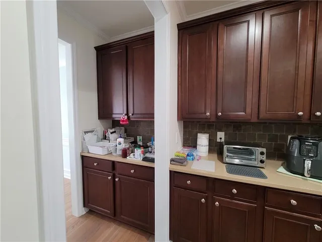 a kitchen with a sink and cabinets
