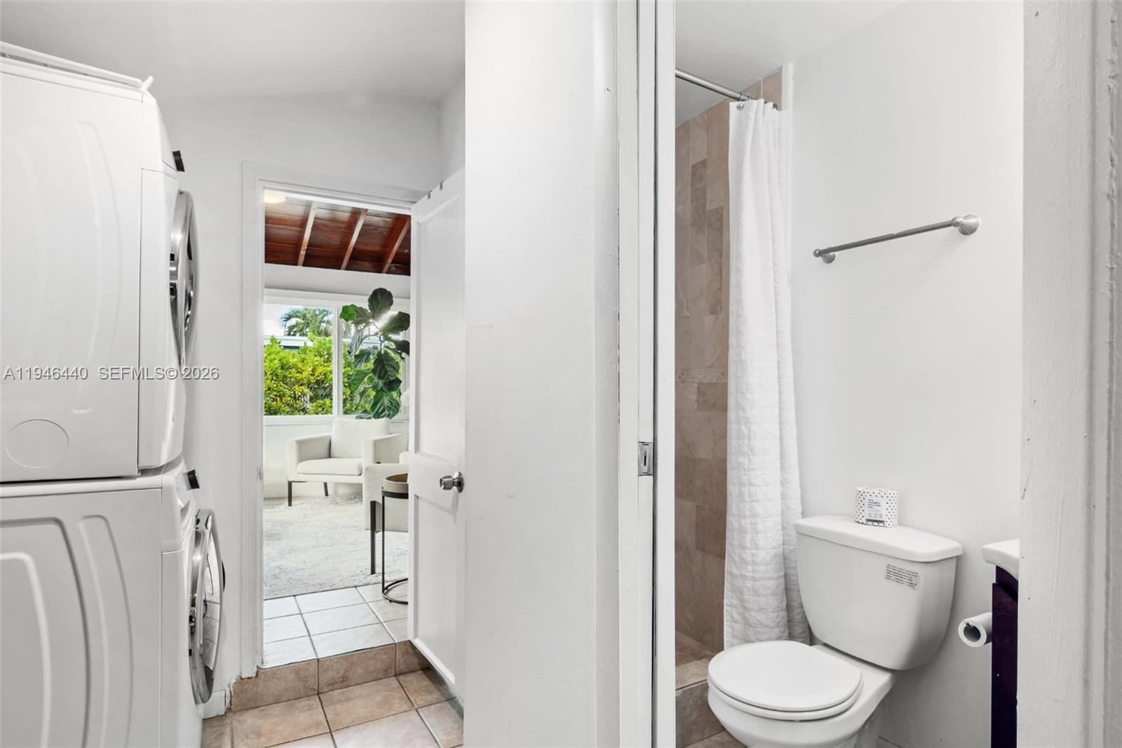 3151 Southwest 20th Street, Unit 1 Miami, FL 33145 - Photo 14 of 18 a white toilet sitting next to a bathroom