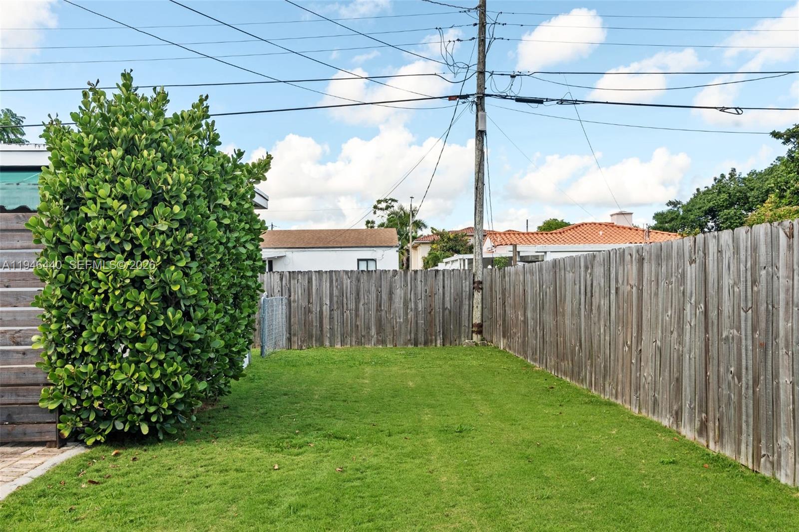 3151 Southwest 20th Street, Unit 1 Miami, FL 33145 - Photo 17 of 18 a view of a backyard with a fence