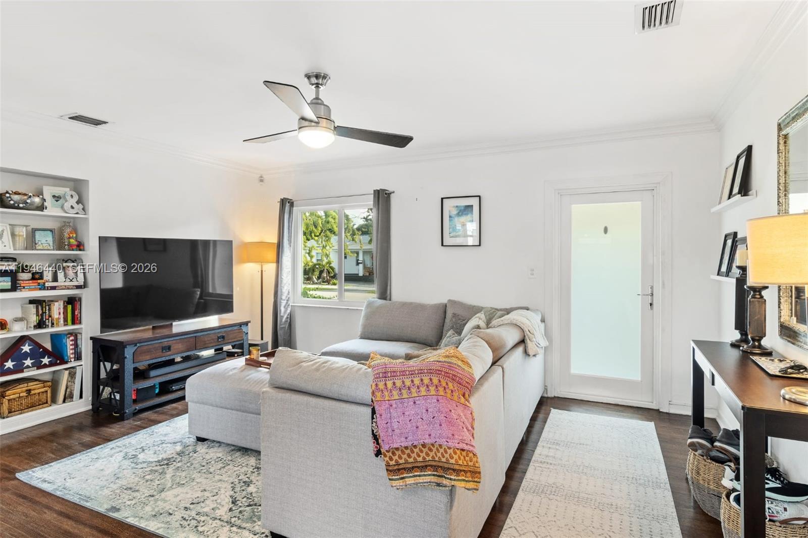 3151 Southwest 20th Street, Unit 1 Miami, FL 33145 - Photo 3 of 18 a living room with furniture and a flat screen tv