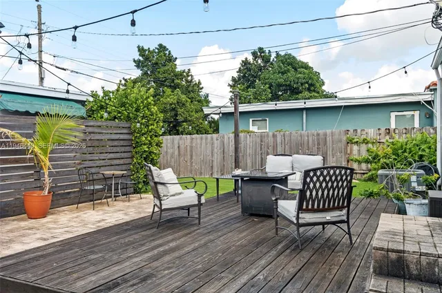 a view of a patio with a table and chairs