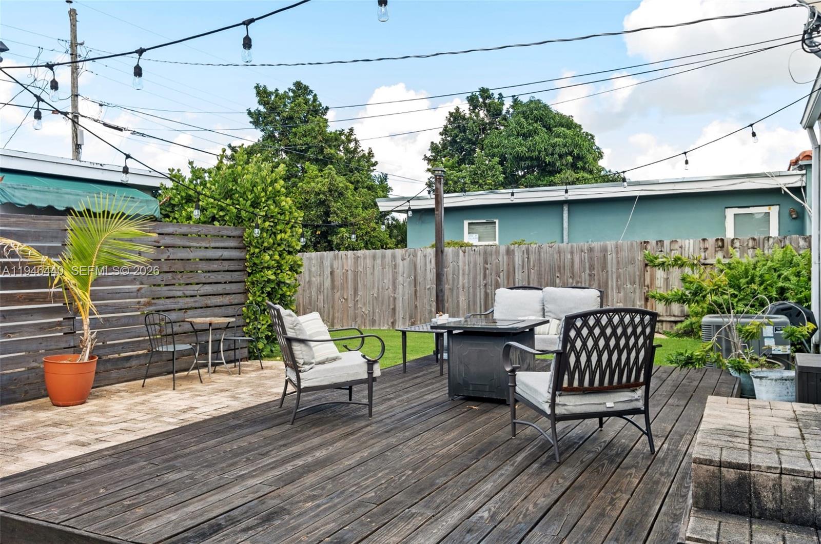 3151 Southwest 20th Street, Unit 1 Miami, FL 33145 - Photo 6 of 18 a view of a patio with a table and chairs