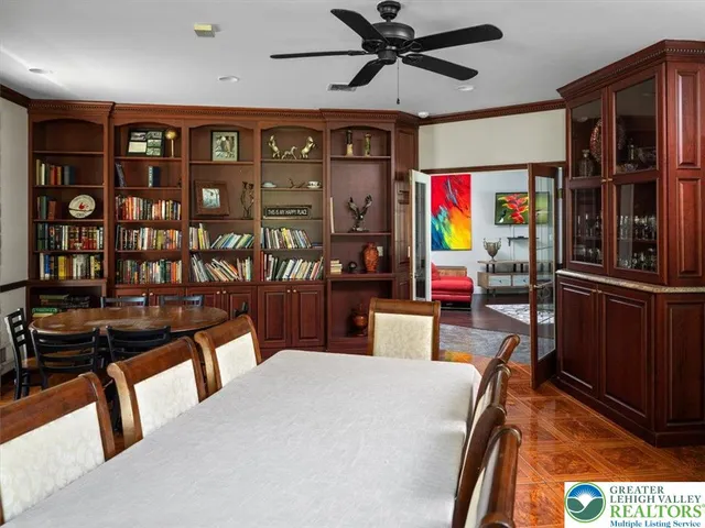 a kitchen with a stove and living room
