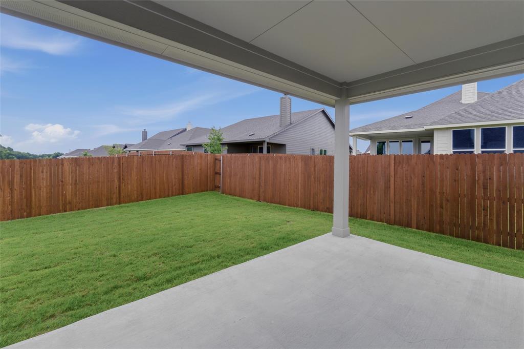 1237 Frio Drive Springtown, TX 76082 - Photo 20 of 25 Covered patio featuring a concrete slab and support columns