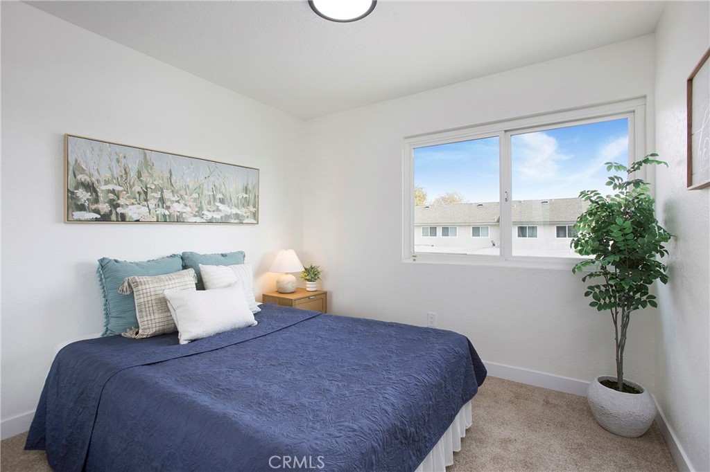 519 Breezewood Court Brea, CA 92821 - Photo 14 of 30 a bedroom with a bed and a potted plant