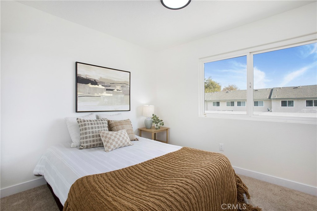 519 Breezewood Court Brea, CA 92821 - Photo 18 of 30 a bedroom with a bed and a painting on the wall