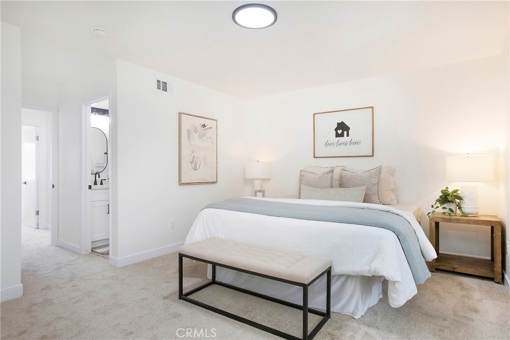 519 Breezewood Court Brea, CA 92821 - Photo 10 of 30 a bedroom with a bed and lamp