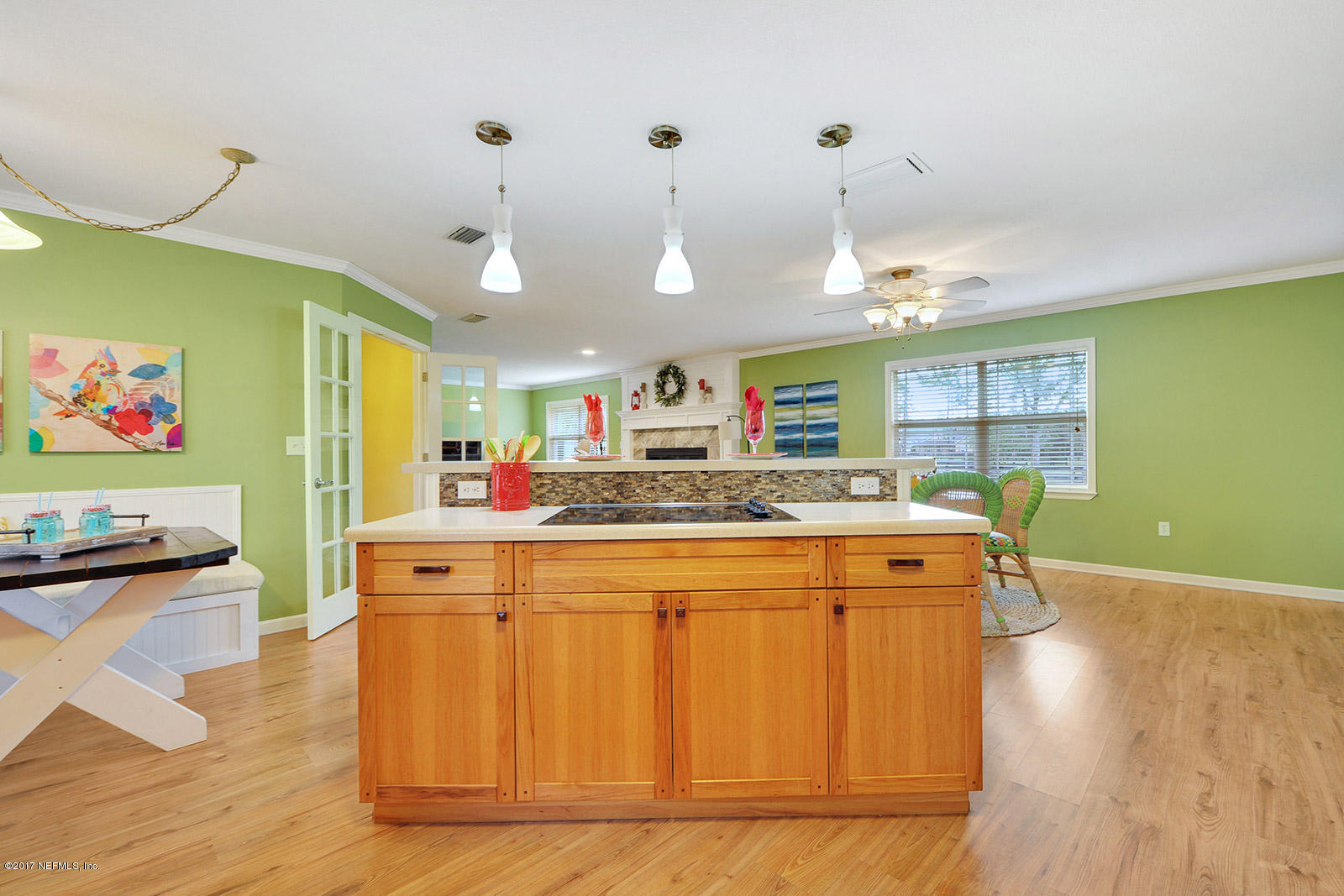 5280 Truman Pacetti Road St. Augustine, FL 32092 - Photo 11 of 34 a large kitchen with stainless steel appliances granite countertop a refrigerator a stove and a wooden floors
