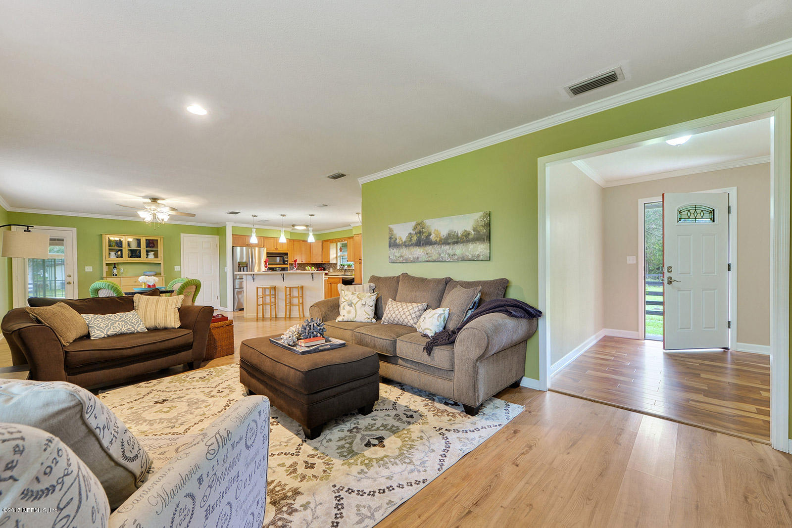 5280 Truman Pacetti Road St. Augustine, FL 32092 - Photo 16 of 34 a living room with furniture and a large window