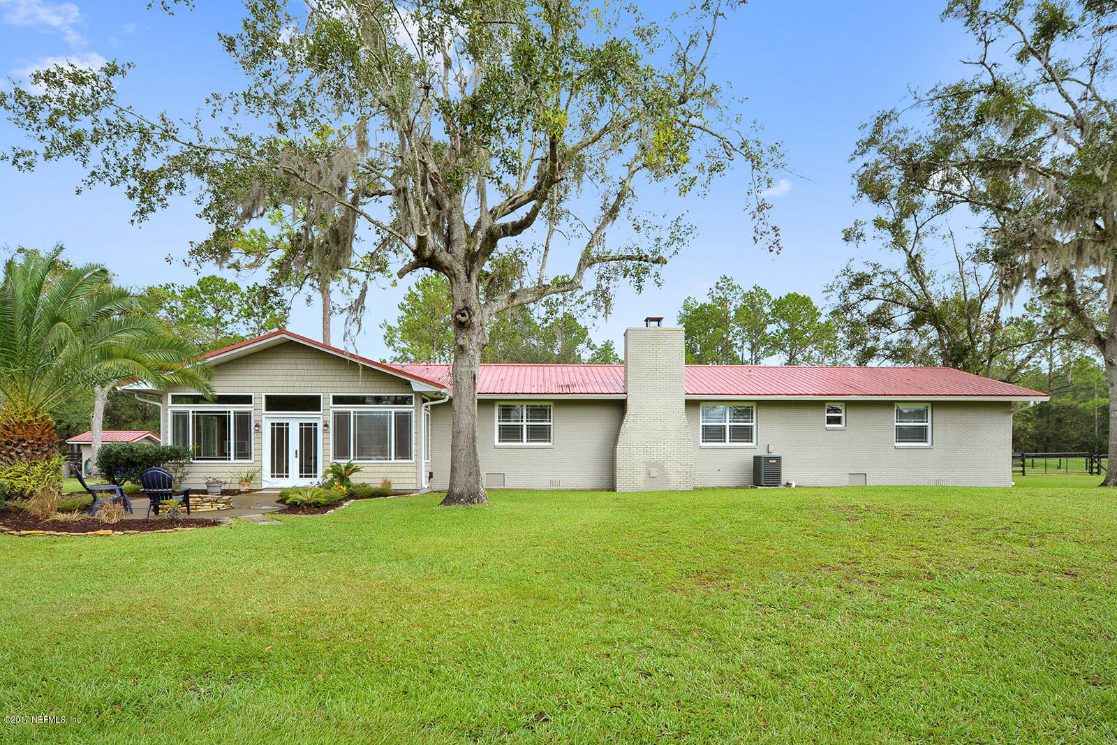 5280 Truman Pacetti Road St. Augustine, FL 32092 - Photo 2 of 34 a front view of a house with a yard