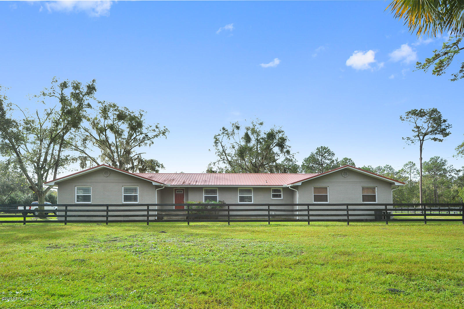 5280 Truman Pacetti Road St. Augustine, FL 32092 - Photo 29 of 34 a front view of house with yard and seating area