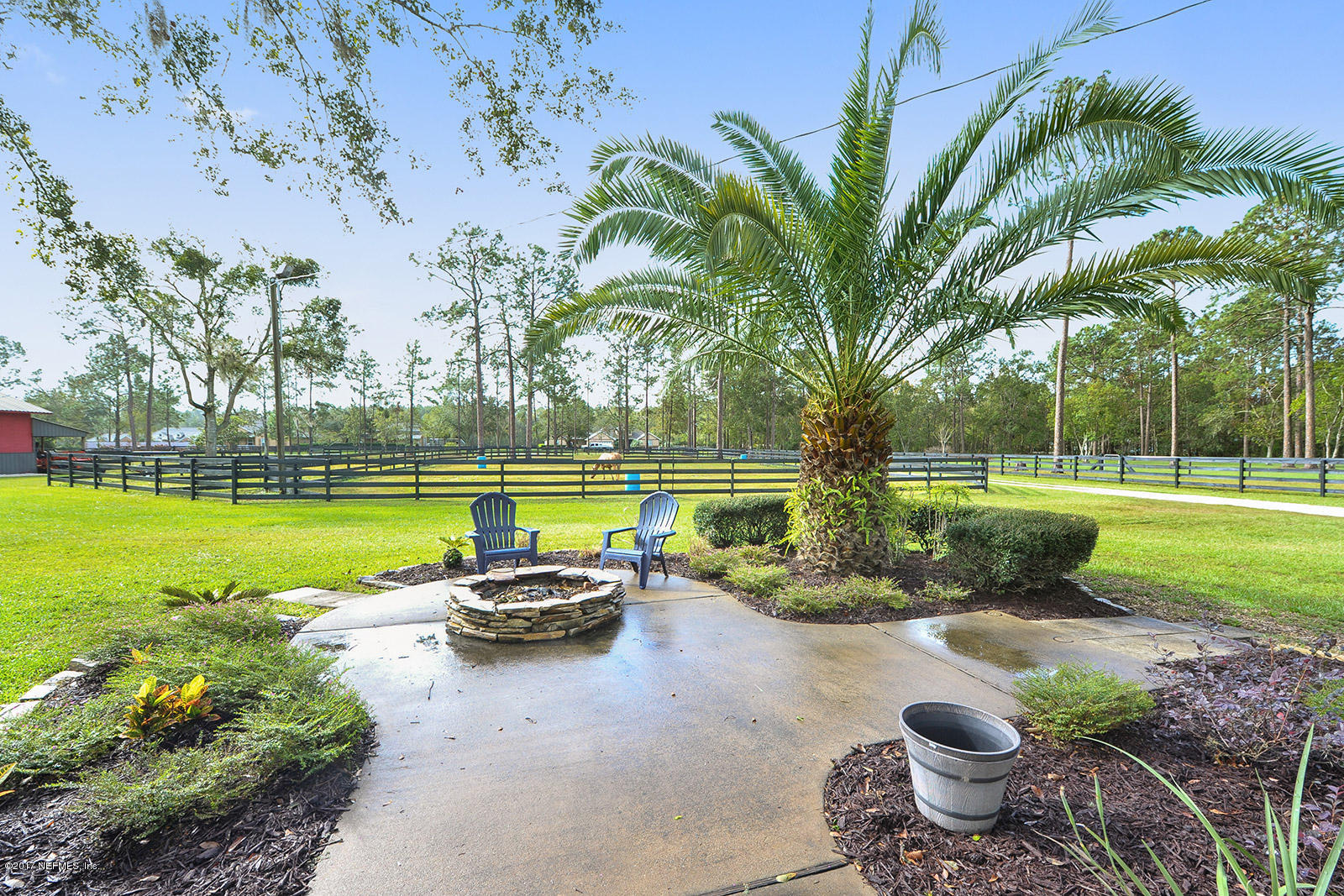 5280 Truman Pacetti Road St. Augustine, FL 32092 - Photo 33 of 34 a view of a patio with swimming pool and garden