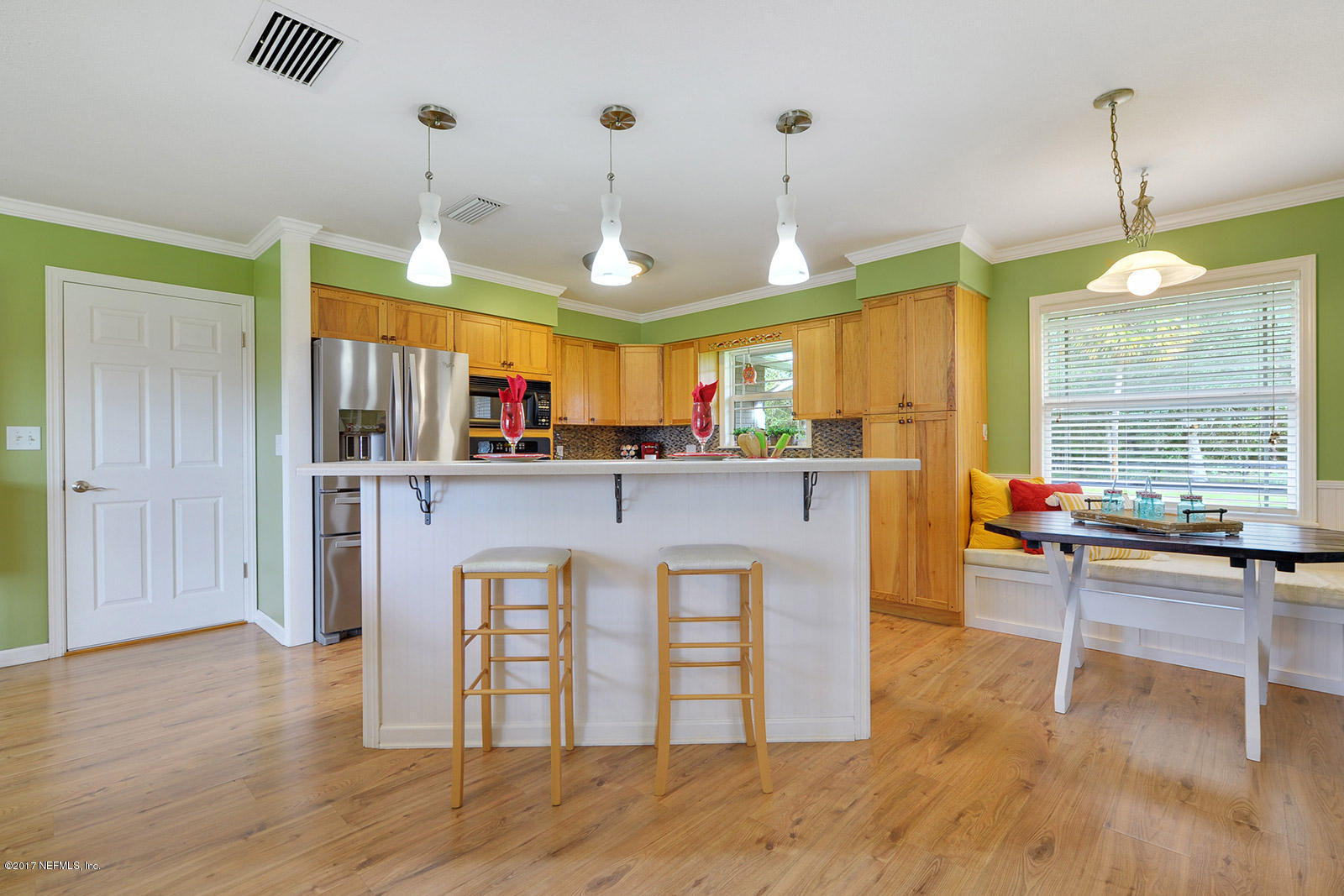 5280 Truman Pacetti Road St. Augustine, FL 32092 - Photo 8 of 34 a kitchen with stainless steel appliances granite countertop a stove and cabinets