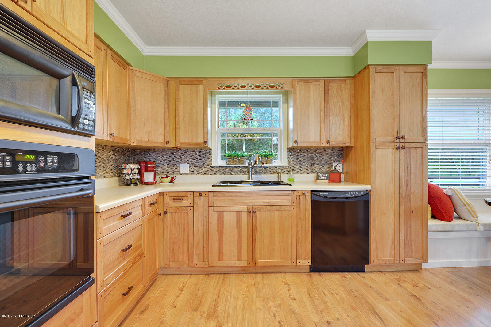 5280 Truman Pacetti Road St. Augustine, FL 32092 - Photo 10 of 34 a kitchen with stainless steel appliances granite countertop a stove a sink and a refrigerator