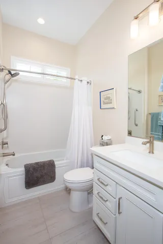 a bathroom with a sink a toilet and a bathtub