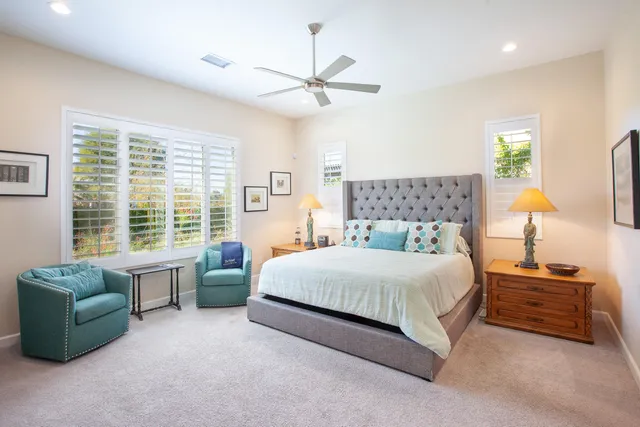 a bedroom with a bed and a couch