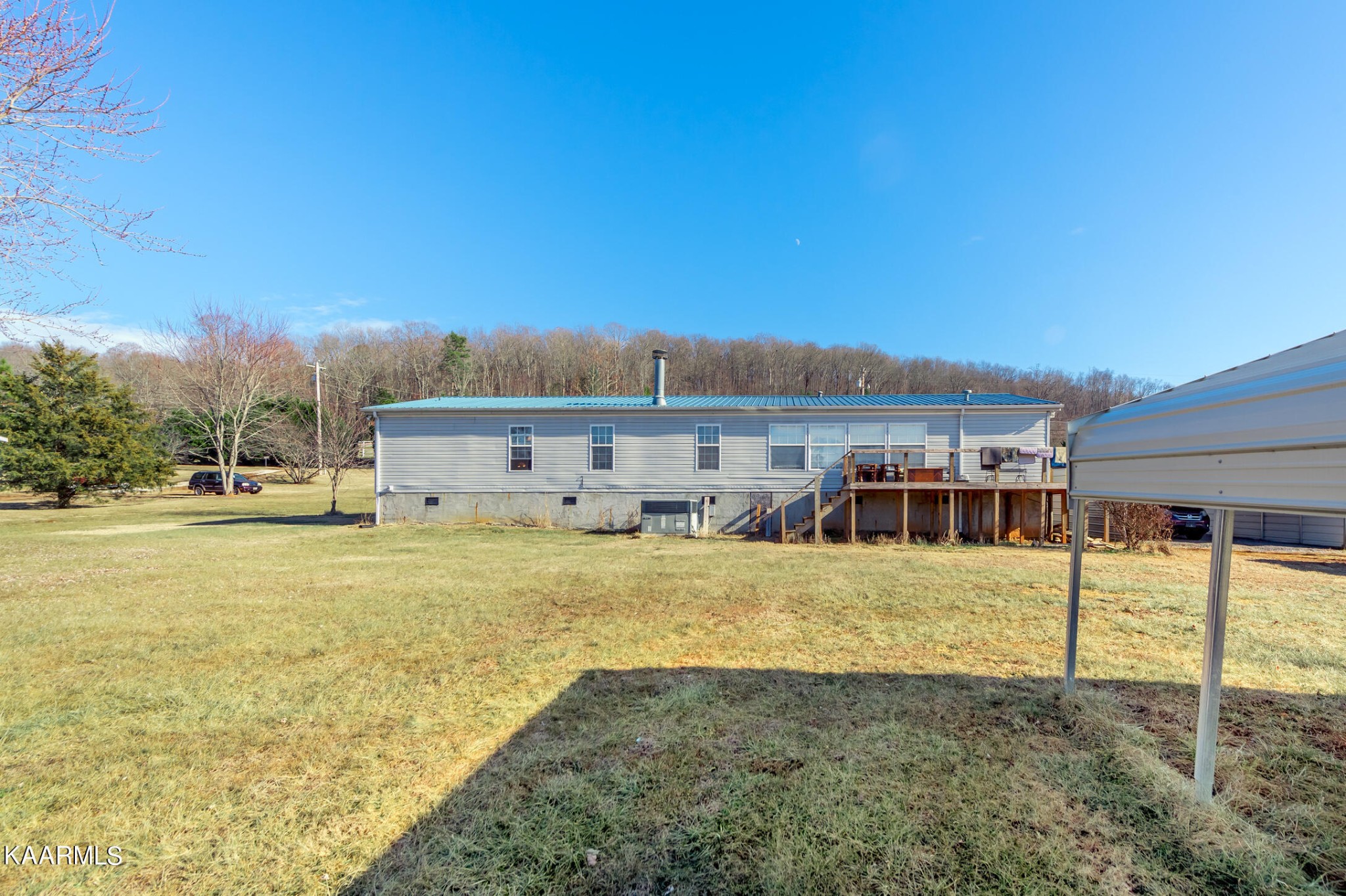 2382 River Road Kingston, TN 37763 - Photo 15 of 60 a view of a house with a yard and sitting area