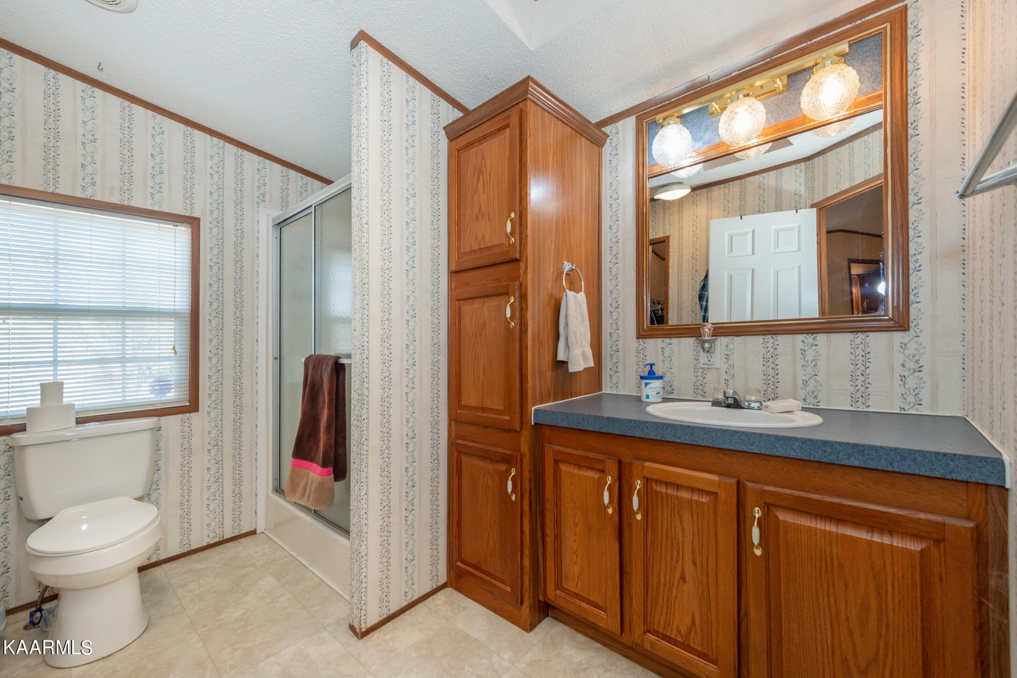 2382 River Road Kingston, TN 37763 - Photo 22 of 60 a bathroom with a granite countertop sink toilet and shower