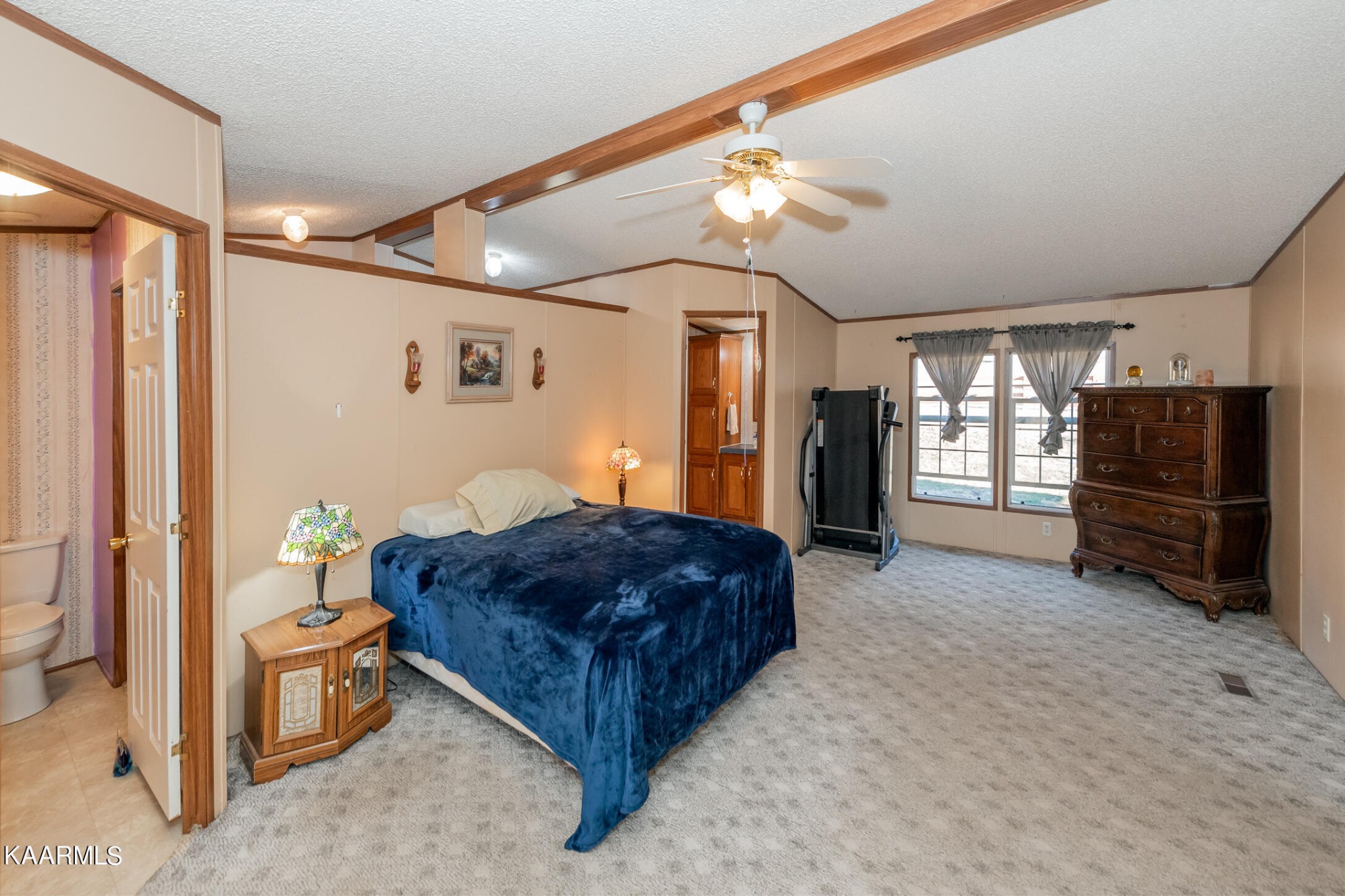2382 River Road Kingston, TN 37763 - Photo 23 of 60 a spacious bedroom with a bed and a television
