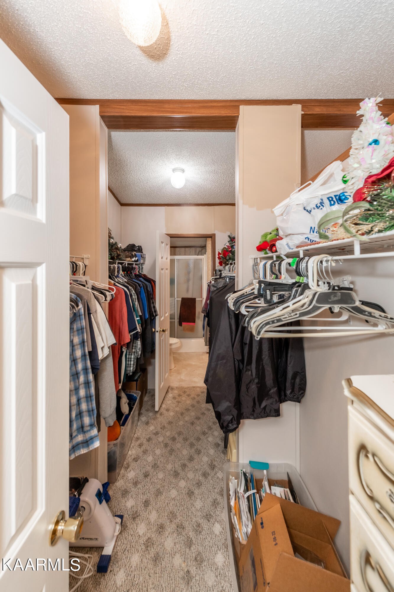 2382 River Road Kingston, TN 37763 - Photo 24 of 60 a view of walk in closet with clothes and shoes