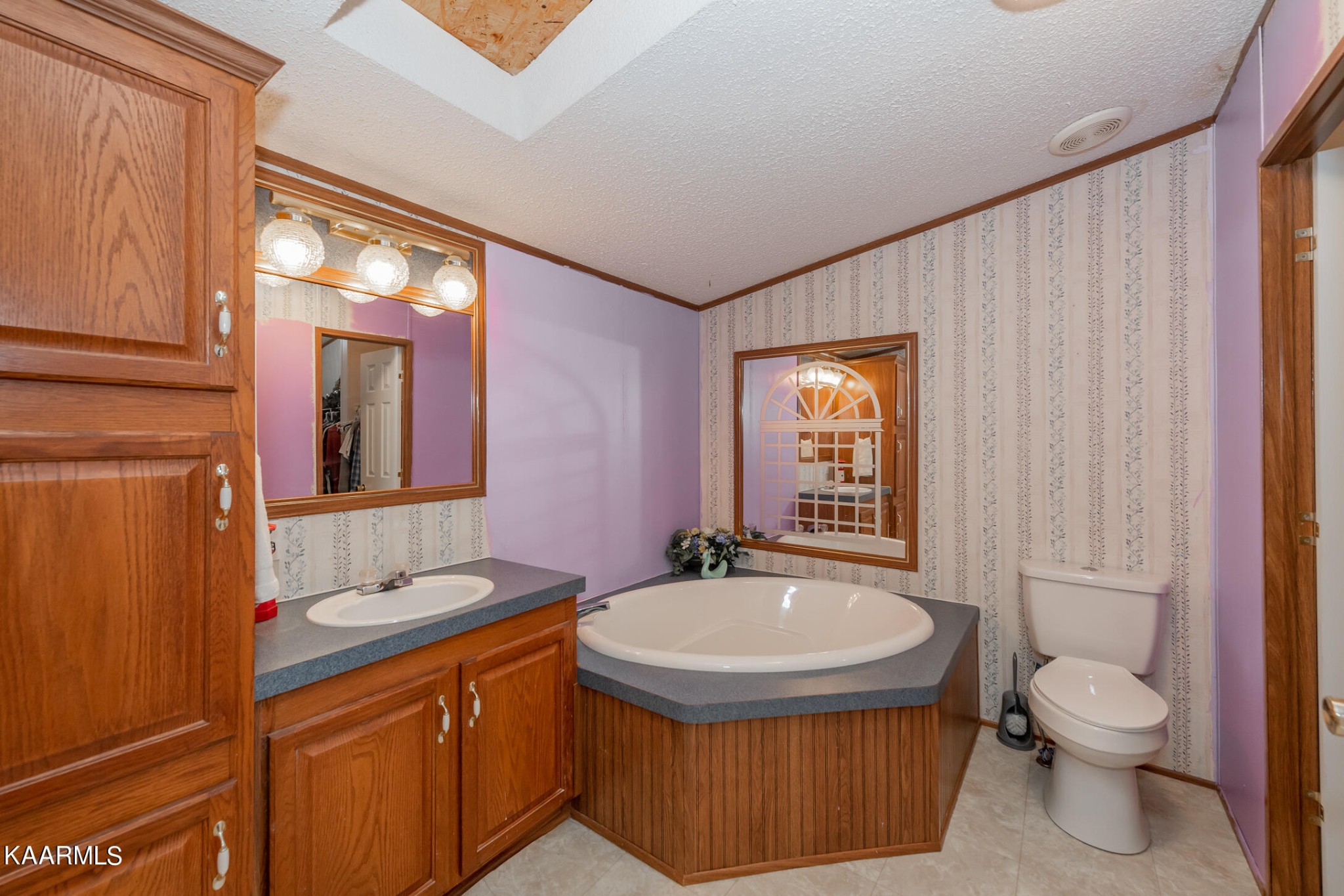 2382 River Road Kingston, TN 37763 - Photo 25 of 60 a bathroom with a sink a toilet and mirror