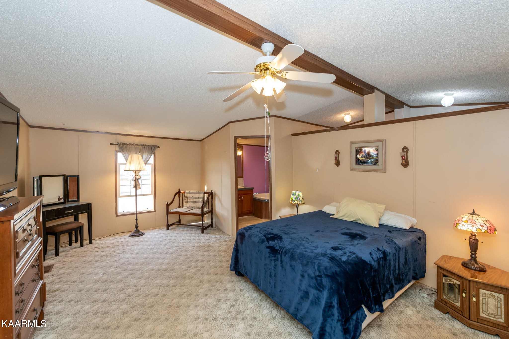 2382 River Road Kingston, TN 37763 - Photo 27 of 60 a spacious bedroom with a bed and a chandelier