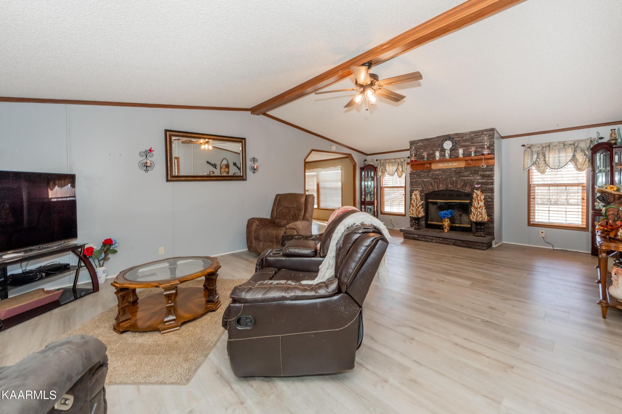 2382 River Road Kingston, TN 37763 - Photo 41 of 60 a living room with furniture and a flat screen tv with wooden floor