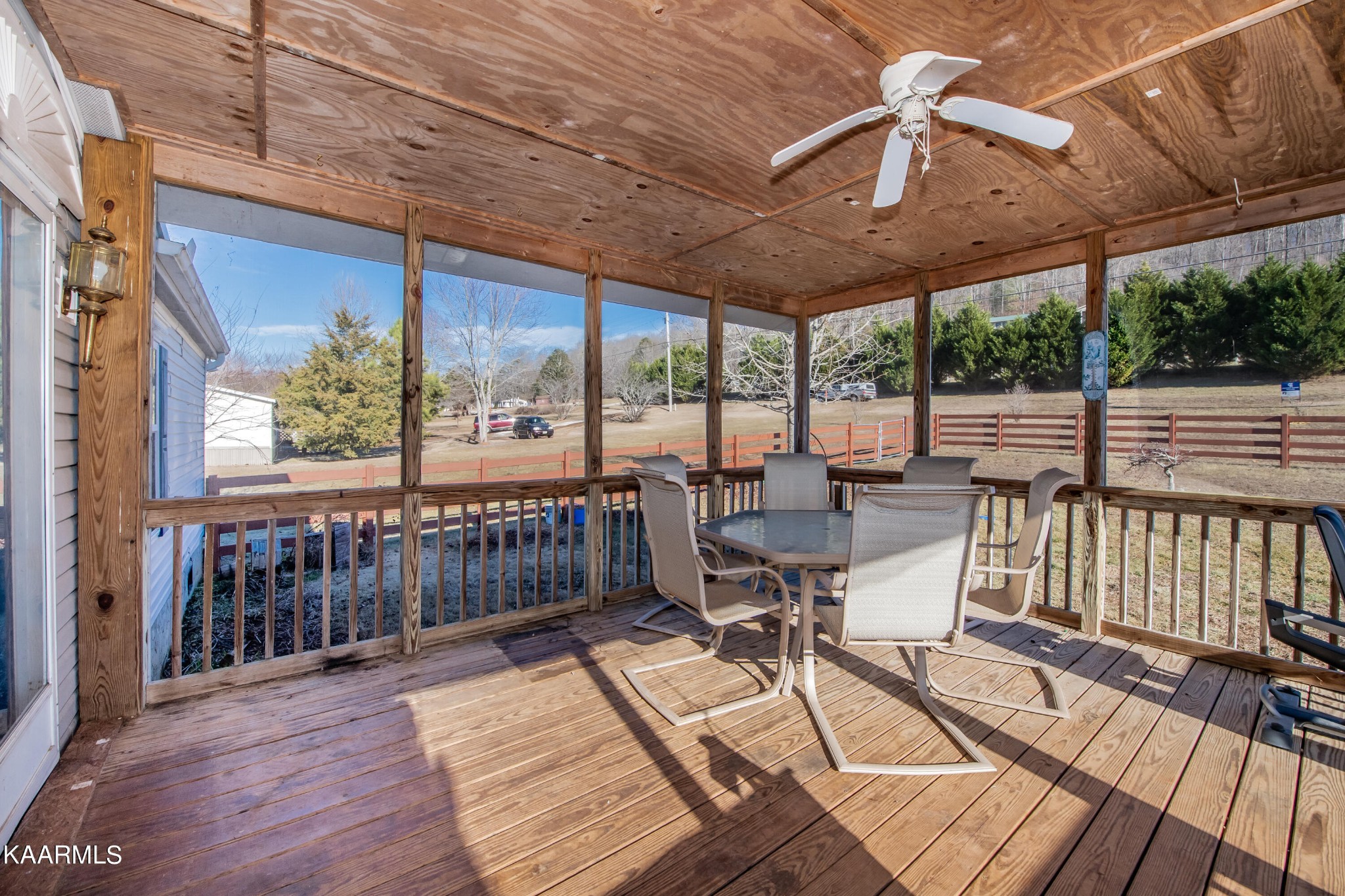 2382 River Road Kingston, TN 37763 - Photo 48 of 60 a view of a balcony with chairs and wooden floor